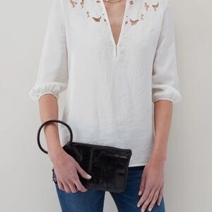 HOBO wristlet style Sable • circular handle clutch. In distressed black.